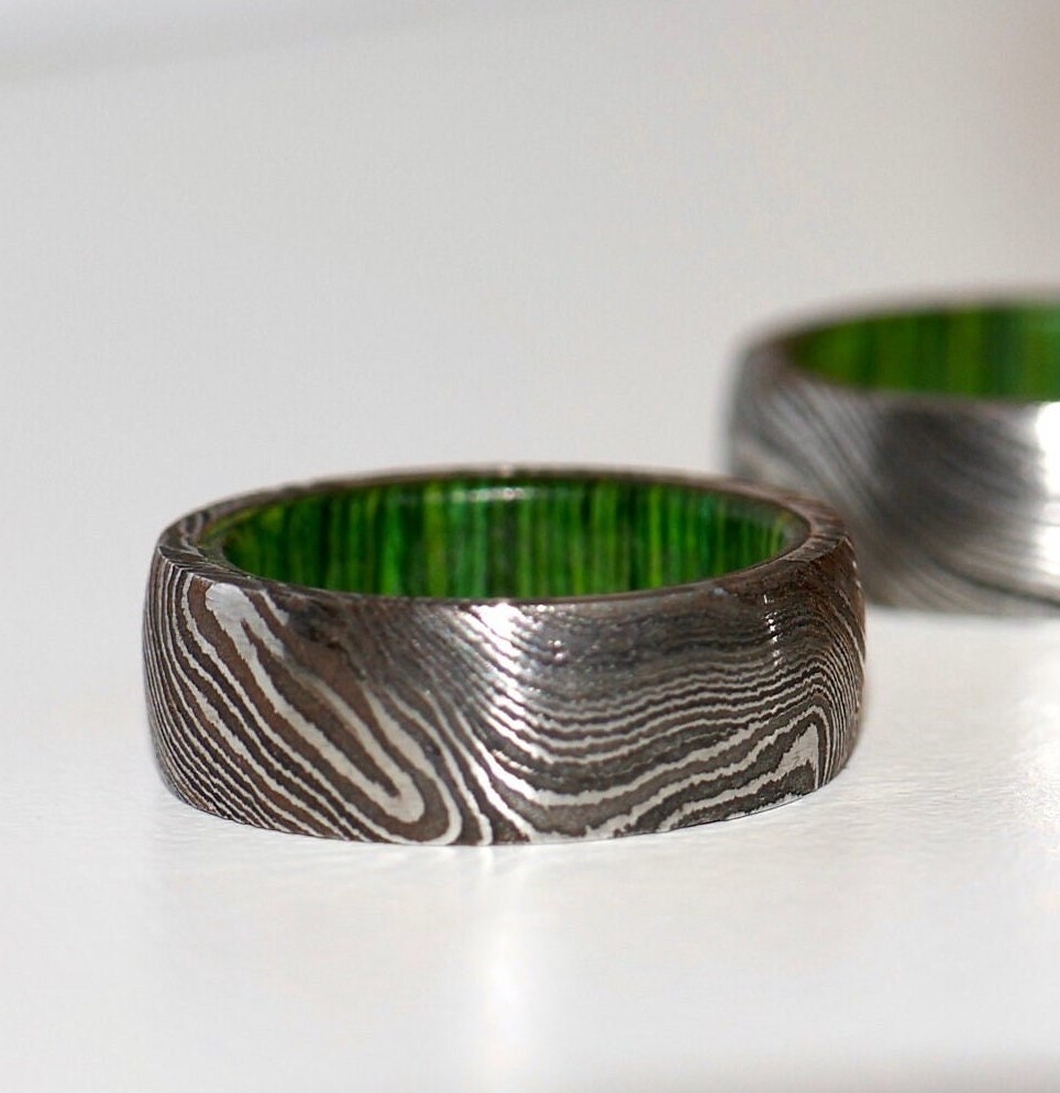 Damascus Steel Green Wood Barrel Ring close up with flash
