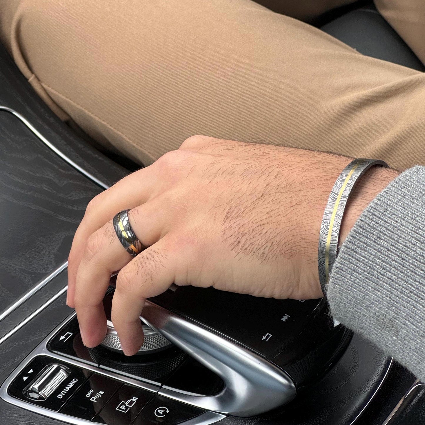 Unique Damascus Steel and Brass Inlay Band man wearing on wedding finger