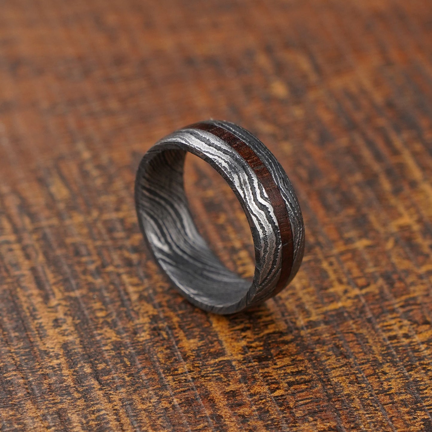 Damascus steel with wooden inlay