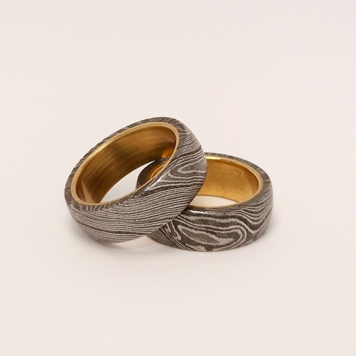 two Damascus and Brass rings barrel style side view