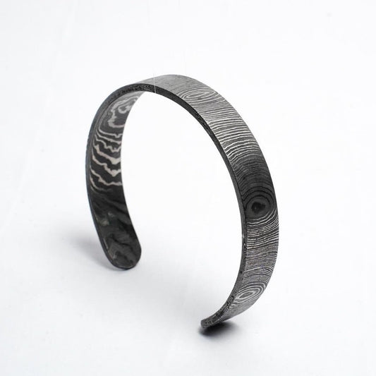 Damascus steel antler cuff against white background